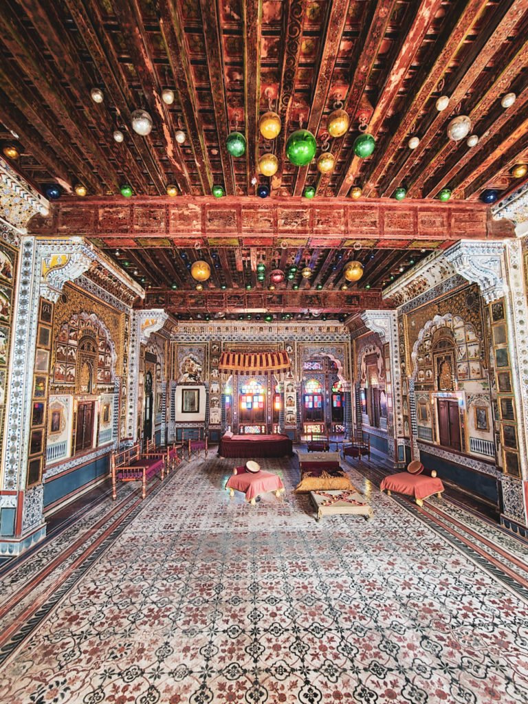 A room filled with mirrors and ornaments in Mehrangarh fort.