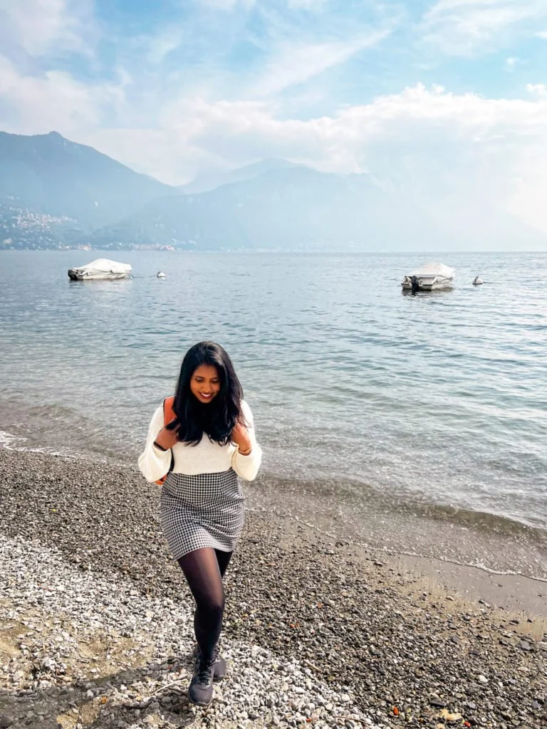 Kiki from RooKiExplorers walking along the shores of Lake Como in Menaggio.