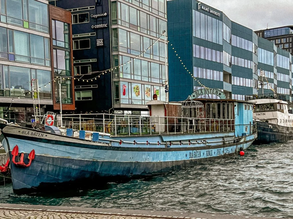 A couple of large boats docked at the harbor in Malmo.