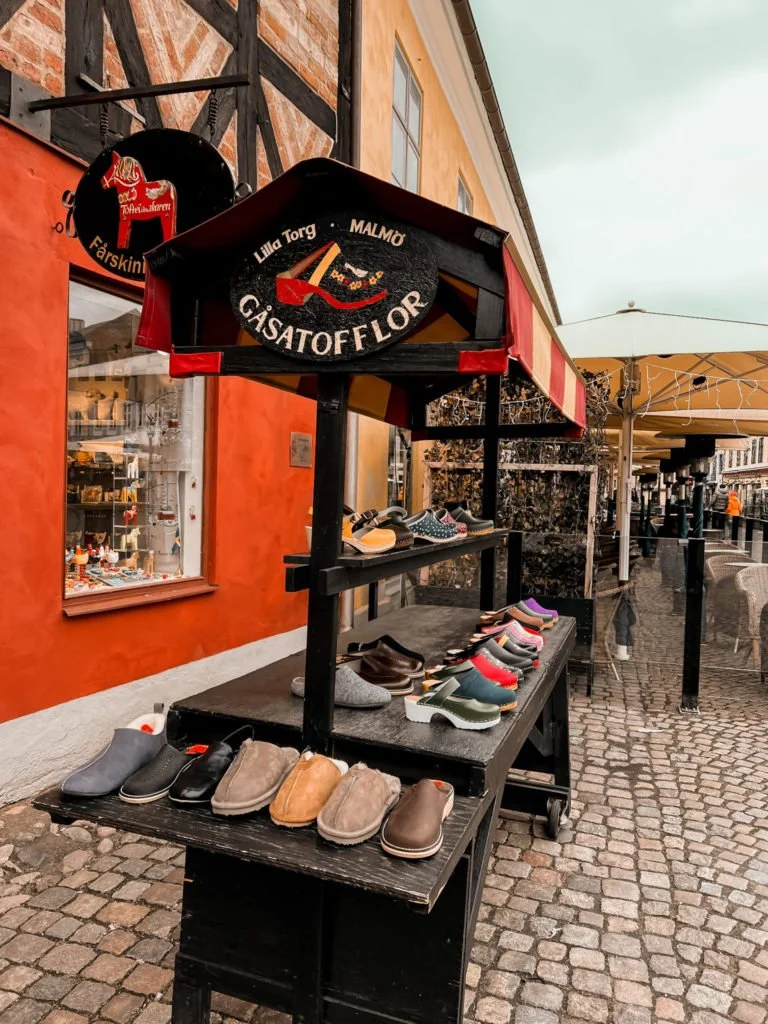 Several shoes displayed outside a store in Lilla Torg in Malmo.