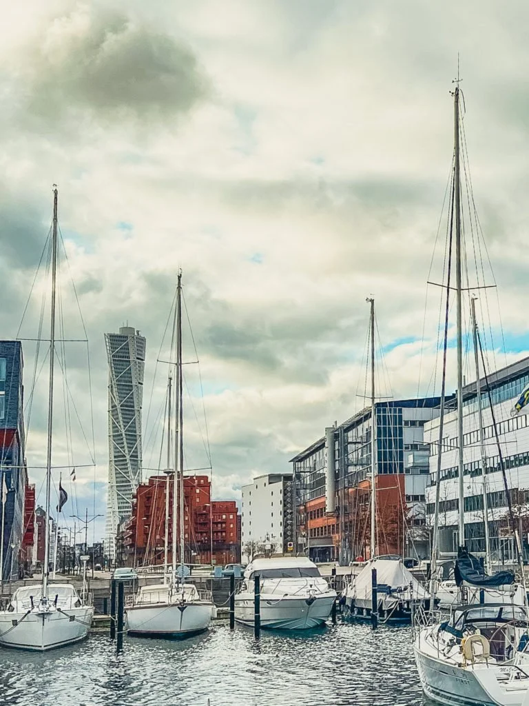 The Turning Torso of Malmo with yachts docked in the harbor.