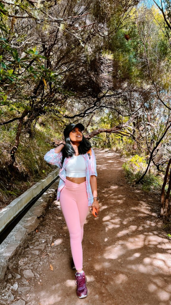 Kiki from RooKiExplorers posing during a levada walk in Madeira.