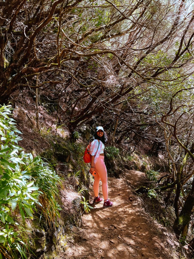 Kiki from RooKiExplorers smiling happily during a levada walk in Madeira.