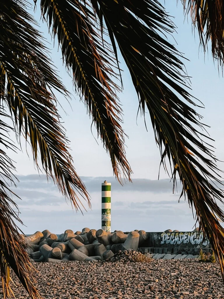 The green and white colored lighthouse in Funchal, Madeira