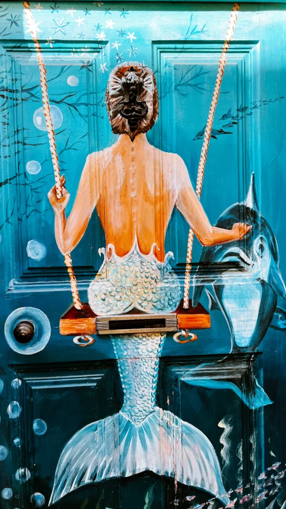 A door with the artwork of a mermaid in Rua de Santa Maria in Funchal, Madeira.