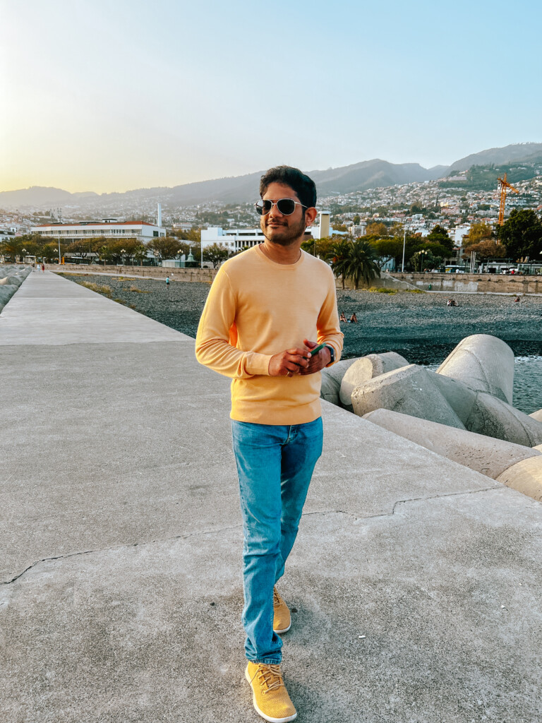 Roopesh from RooKiExplorers posing in Funchal's waterfront.