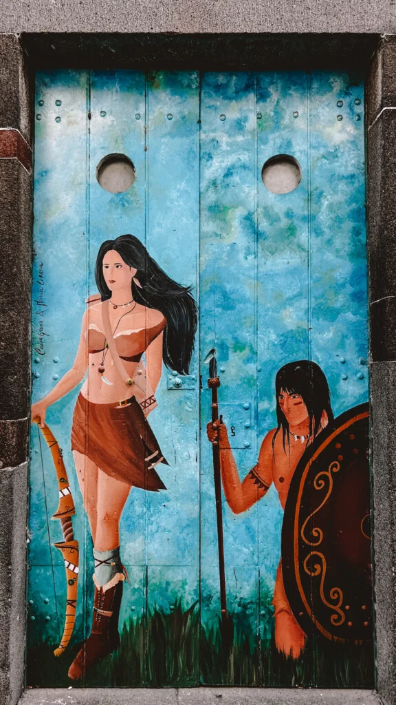 A door with the artwork of warriors in Rua de Santa Maria in Funchal, Madeira.