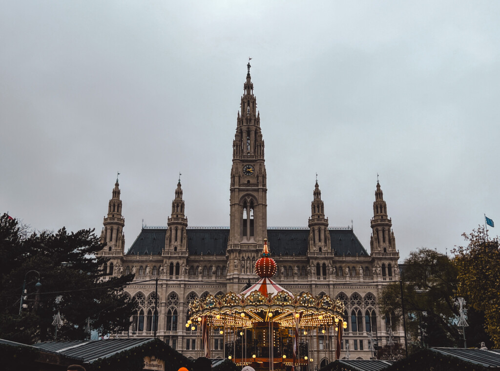 The town hall and carousel in Rathausplatz Christkindlmarkt in Vienna.