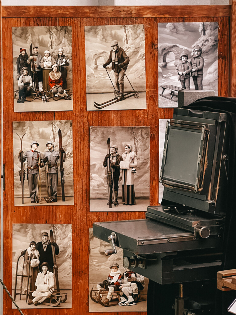Old photos behind a photography processing equipment in Museum Fotoatelier Seidel.