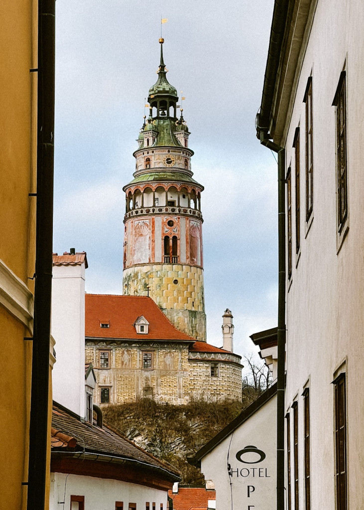 View of Český Krumlov's castle tower from the intersection of Masná and Horní.